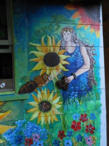 A section from a mural my friend and I recently painted on the back wall of my house: Queen bee and her Guardian